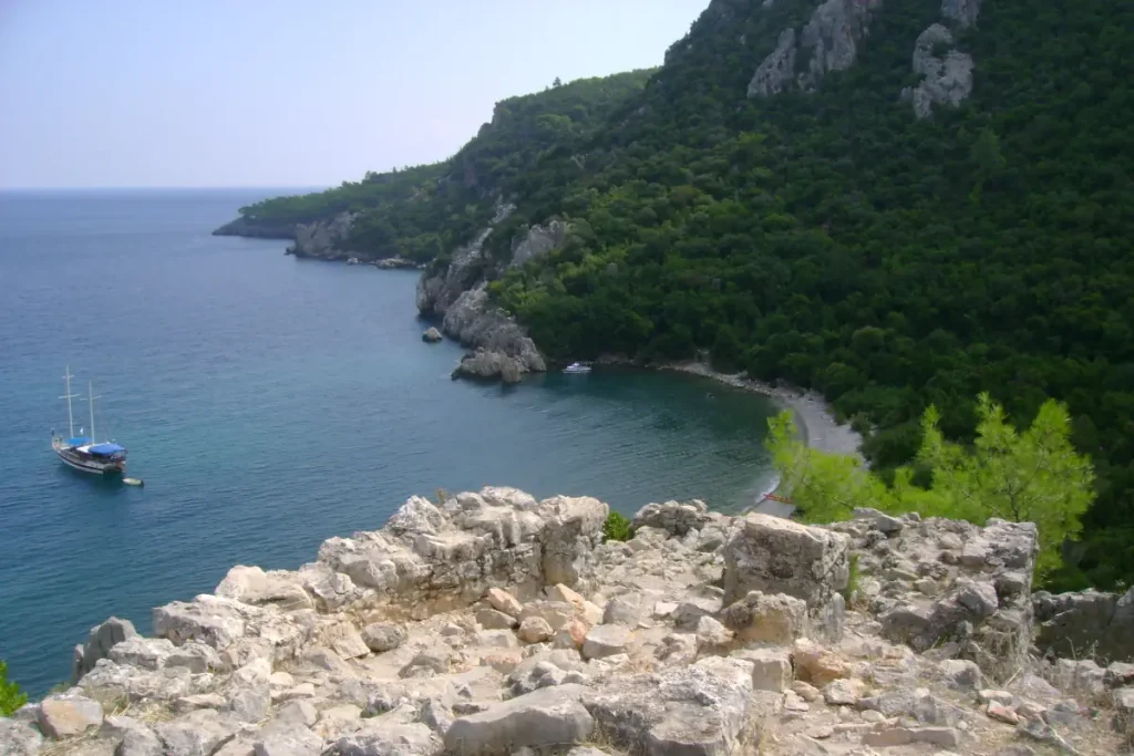 Olympos Beach, as seen from a nearby hill. Atop this hill once stood a Genoese castle, and its ruins are visible in the photo.