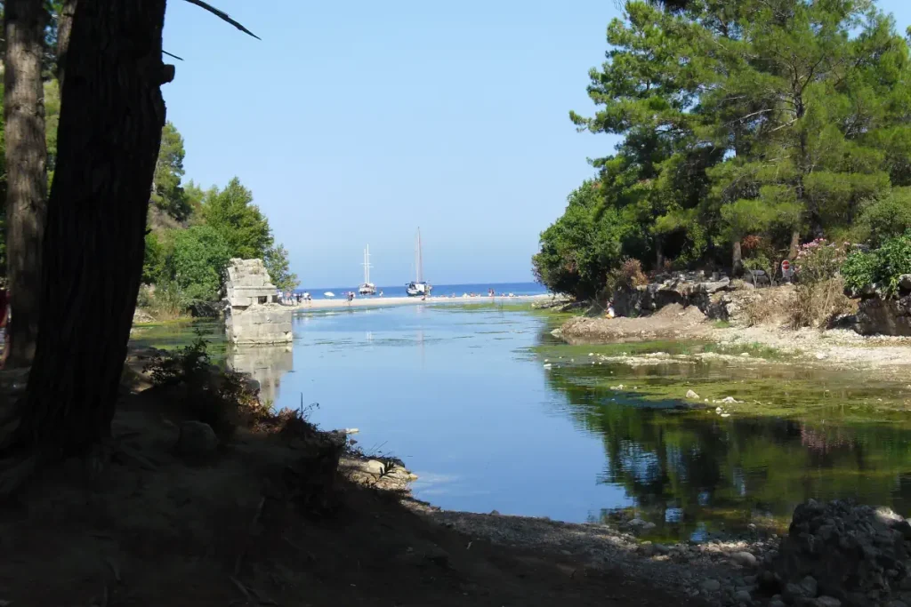 Olympos Beach is reached by following the stream that flows through the ancient ruins of Olympos