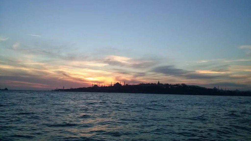 What is the Old Name for Istanbul? Sunset behind historic peninsula of Istanbul (Byzantium), a photo I took aboard a ferry in 2015. From left to right, the silhouettes of the Blue Mosque, Hagia Sophia, Beyazıt Tower, New Mosque, and Süleymaniye Mosque can be seen.